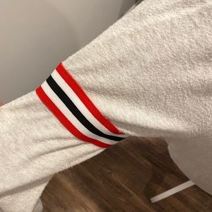 Super cute sweater with tie bottom